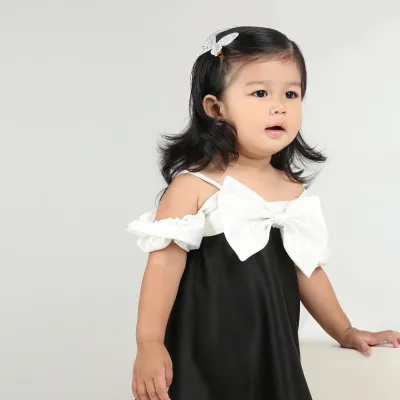 Elegant black party dress for girls with stylish white bow and sleeves